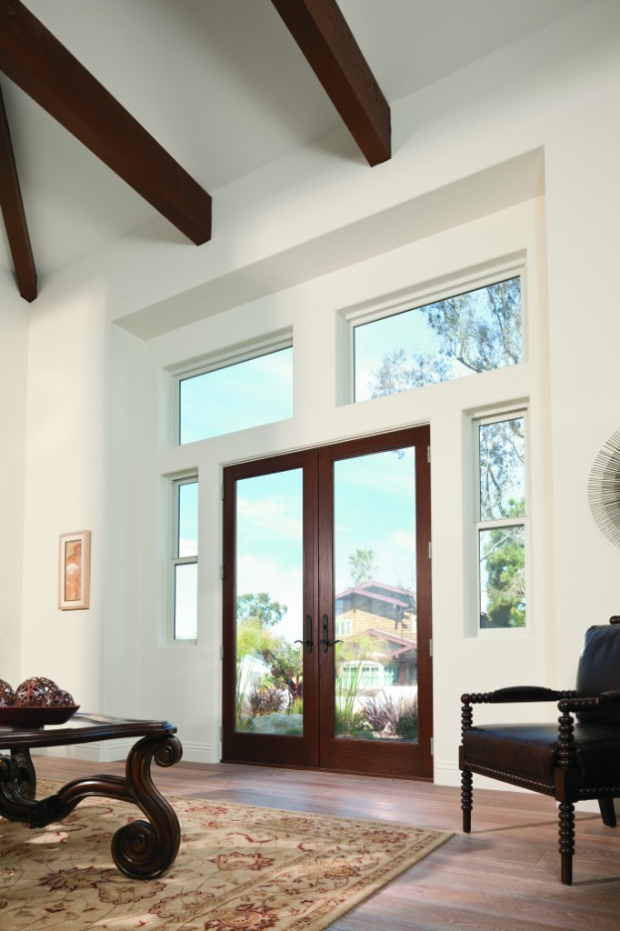 Living room with dark wood hinged patio door