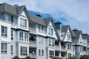 White townhomes with asphalt roof