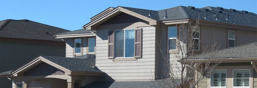 Tan house with new roof
