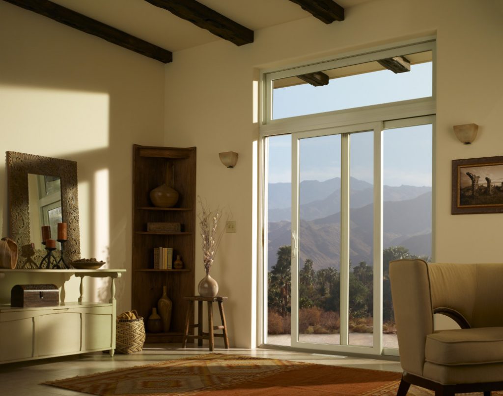 Living room with large sliding door with mountains outside