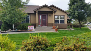 Tan house with dark brown accents