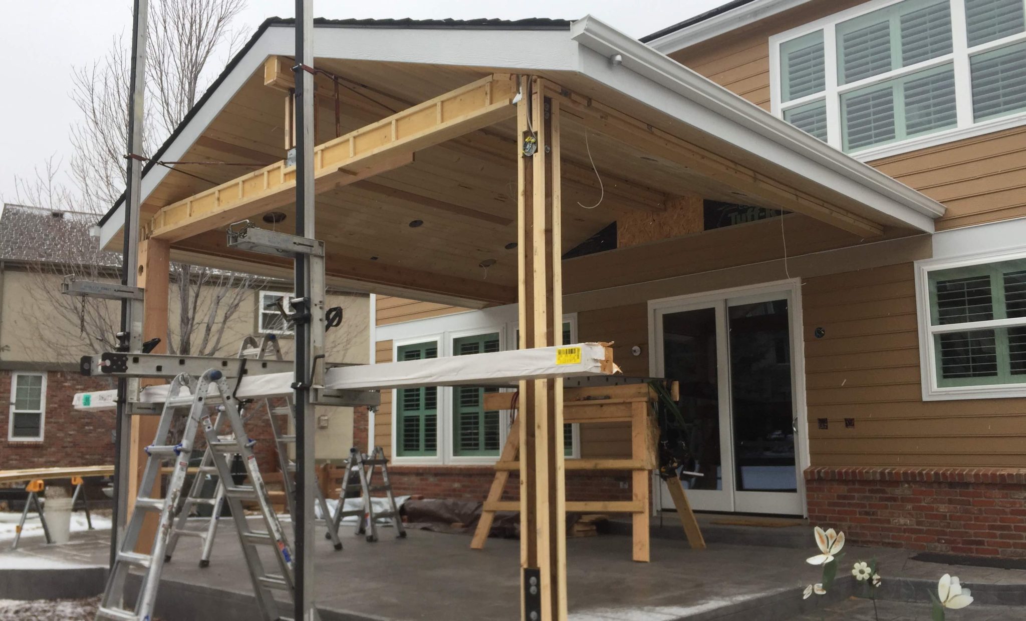 Construction on new covered roof with equipment