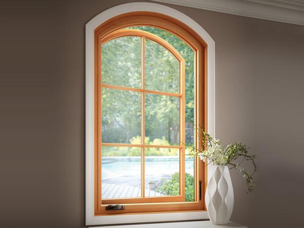 Natural wood arch window