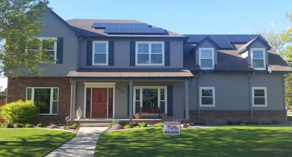 Dark grey house with black shudders
