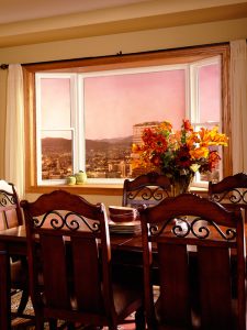 Dining room table with sunset in window