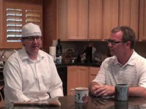 Painter in kitchen talking with customer