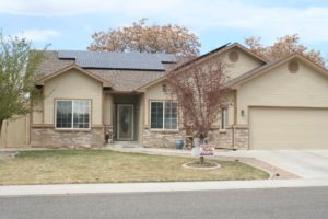 Exterior tan house with stone foundation
