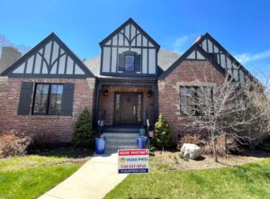 traditional brick home gets new white and brown accent paint Vivax Pros House Painters
