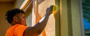 Vivax Pros painter prepares stucco for new paint