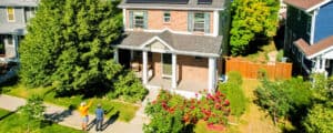 aerial view of brick home with recently painted trim and door Vivax Pros